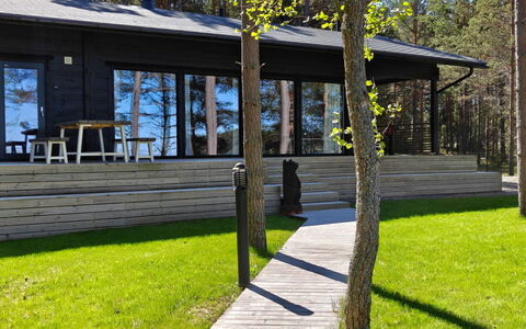 Sandstrand: Wood, Wood Flooring, Hardwood, Flooring, Deck, Plank, Shade, Porch, Wood Stain, Outdoor Furniture