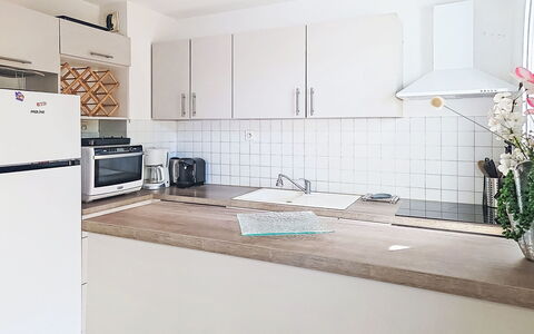 Nautica: Kitchen, Kitchen Appliance, Flooring, Major Appliance, Countertop, Interior Design, Floor, Wood, Cabinetry, Furniture