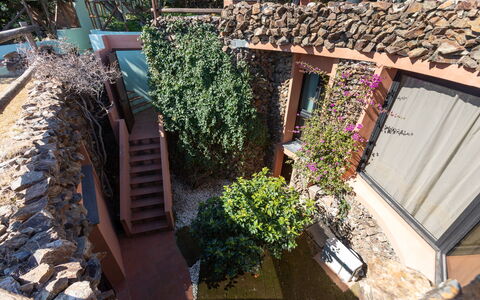 Villa Boi: Wall, Architecture, Stone Wall, Garden, Shade, Landscaping, Hacienda, Backyard