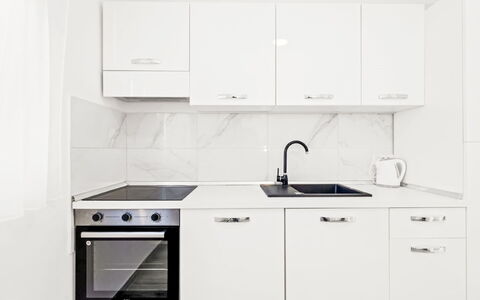 Feniks: Kitchen, Kitchen Appliance, Countertop, Cabinetry, Major Appliance, Flooring, Wood, Interior Design, Floor, Furniture
