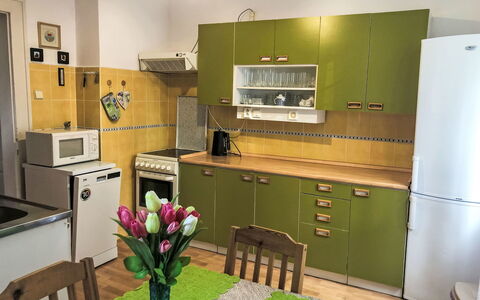 Forestside Villa: Furniture, Flooring, Kitchen, Major Appliance, Wood, Kitchen Appliance, Cabinetry, Interior Design, Floor, Countertop