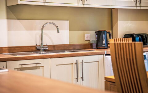 Easter Caiplich: Countertop, Kitchen, Flooring, Cabinetry, Interior Design, Wood, Kitchen Appliance, Furniture, Floor, Major Appliance