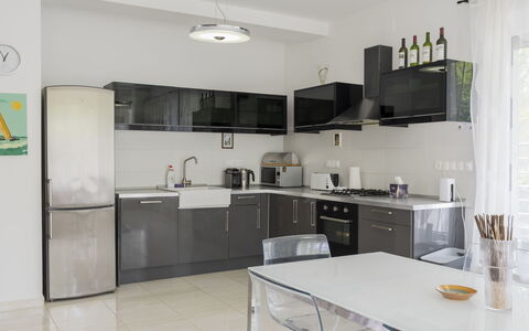 Posha: Furniture, Kitchen Appliance, Kitchen, Interior Design, Countertop, Flooring, Major Appliance, Cabinetry, Wood, Floor
