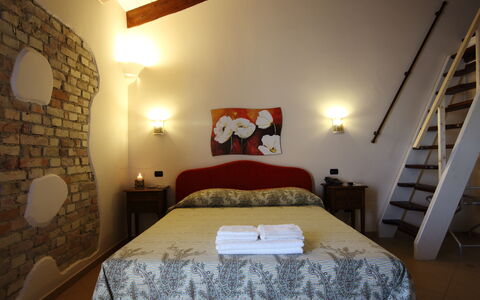 Casale dei Ciliegi: Wall, Furniture, Home, Door, Bedroom, Lamp, Light Fixture, Chair, Houseplant, Bed