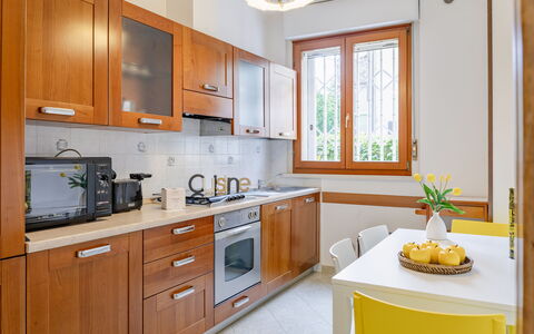Corte Marina Apartment: Kitchen, Kitchen Appliance, Major Appliance, Countertop, Wood, Cabinetry, Furniture, Flooring, Interior Design, Home