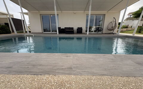 A Casa di Chica: Swimming Pool, Composite Material, Floor, Shade, Concrete, Outdoor Furniture, Design, Resort, Water Feature, Chair