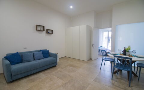 Elementi Luxury Otranto: Flooring, Floor, Interior Design, Wood, Furniture, Ceiling, Room, Lighting, Apartment, Living Room