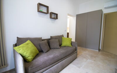 Elementi Luxury Otranto: Furniture, Interior Design, Flooring, Floor, Couch, Wood, Room, Lighting, Living Room, Home