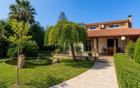 Villa Lina: Shrub, House, Residential Area, Garden, Home, Shade, Landscaping, Estate, Backyard