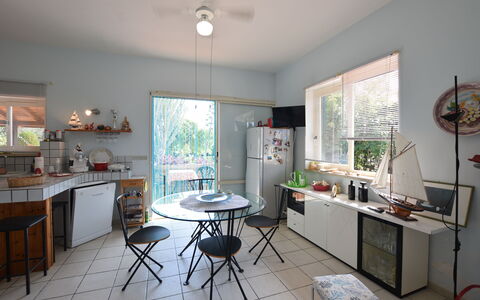 Villa Lina: Furniture, Interior Design, Chair, Table, Ceiling, Kitchen & Dining Room Table, Lighting, Light Fixture, Flooring, Kitchen