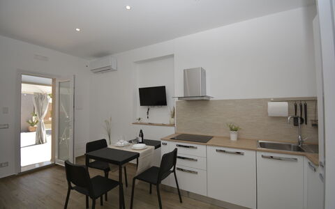 Villa Benvenuti al Sud: Furniture, Interior Design, Wood, Flooring, Floor, Countertop, Room, Ceiling, Lighting, Kitchen
