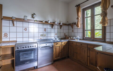 Villa Golly: Kitchen, Wood, Interior Design, Flooring, Ceiling, Countertop, Room, Cabinetry, Kitchen Appliance, Wood Stain