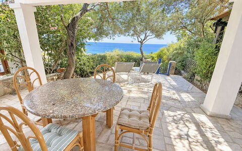 Porto Luna 1: Furniture, Outdoor Furniture, Chair, Table, Outdoor Table, Sea, Kitchen & Dining Room Table, Coastal And Oceanic Landforms, Shade, Coast