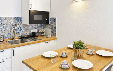 Porto Luna 1: Countertop, Flooring, Kitchen, Furniture, Interior Design, Cabinetry, Floor, Home, Plumbing Fixture, Lighting