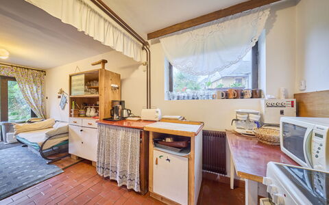 Černý: Furniture, Wood, Interior Design, Room, Flooring, Ceiling, Floor, Lighting, Home, Chair