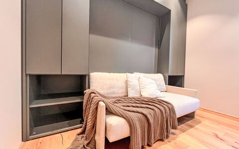Apartment Places2Be: Furniture, Flooring, Interior Design, Wood, Floor, Lighting, Couch, Wood Flooring, Room, Living Room