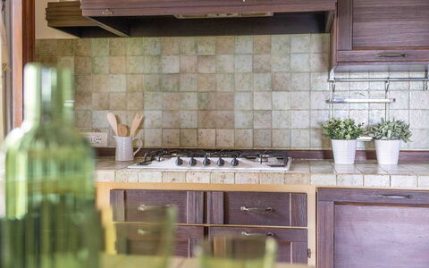 Casa Dolceconero: Kitchen, Countertop, Wood, Interior Design, Flooring, Cabinetry, Kitchen Appliance, Floor, Kitchen Stove, Home