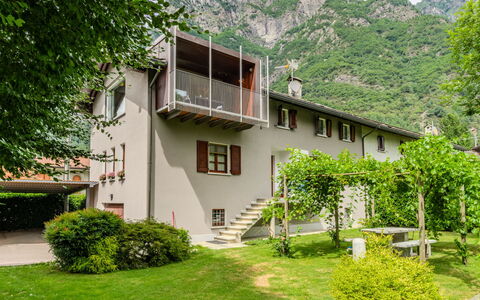 Zani: Residential Area, Mountain Range, Cottage, Hill Station, Valley, Garden, Yard, Estate, Lawn, Alps
