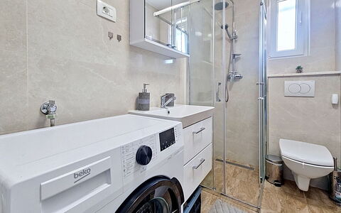 Aurora: Washing Machine, Flooring, Interior Design, Plumbing Fixture, Floor, Bathroom Cabinet, Clothes Dryer, Laundry Room, Sink, Bathroom