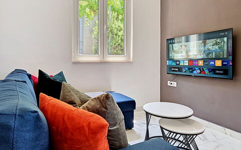 Aurora: Furniture, Interior Design, Electronic Device, Wall, Television, Couch, Television Set, Living Room, Flooring