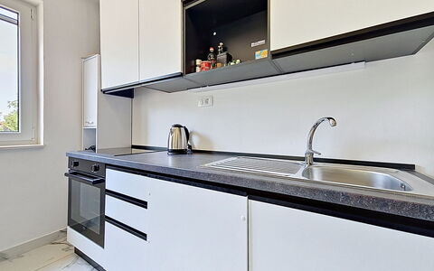 Aurora: Kitchen, Countertop, Cabinetry, Kitchen Appliance, Major Appliance, Flooring, Interior Design, Wood, Kitchen Sink, Home