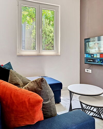 Aurora: Furniture, Interior Design, Electronic Device, Wall, Television, Couch, Television Set, Living Room, Flooring