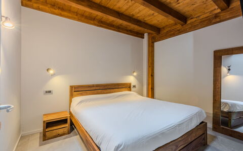 Silvia: Interior Design, Wall, Flooring, Wood, Ceiling, Floor, Bed, Bedroom, Room, Furniture