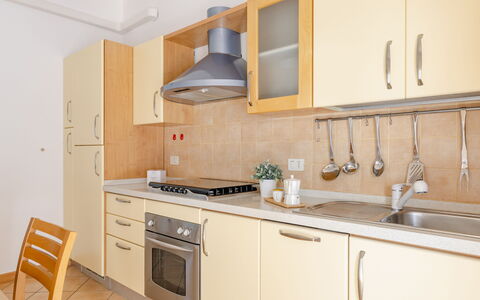 Casa Acquamarina: Kitchen, Countertop, Kitchen Appliance, Wood, Major Appliance, Furniture, Flooring, Interior Design, Cabinetry, Kitchen Sink