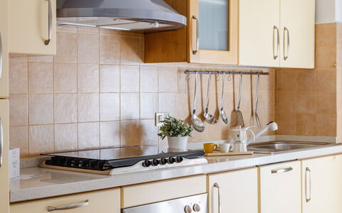 Casa Acquamarina: Kitchen, Countertop, Kitchen Appliance, Cabinetry, Furniture, Major Appliance, Interior Design, Flooring, Wood, Stove