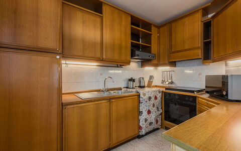 Sun: Kitchen, Cabinetry, Wood, Flooring, Countertop, Kitchen Appliance, Major Appliance, Interior Design, Floor, Room
