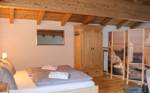Chalet Auszeit: Furniture, Interior Design, Wood, Flooring, Bedroom, Floor, Bed, Ceiling, Room, Lighting