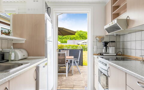 Eufemia - 250M from the Sea: Kitchen, Major Appliance, Flooring, Countertop, Furniture, Kitchen Appliance, Floor, Home, Kitchen Sink, Kitchen & Dining Room Table