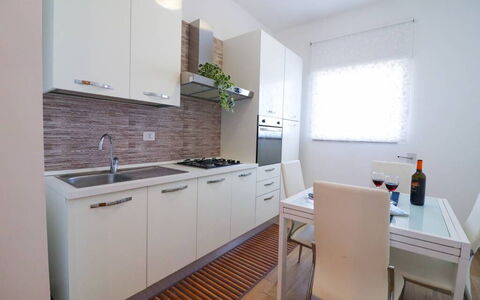 Casa Aurora a Otranto: Kitchen, Major Appliance, Flooring, Countertop, Kitchen Appliance, Interior Design, Wood, Floor, Furniture, Cabinetry