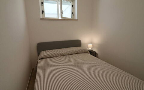 Nausica: Bedroom, Bed, Floor, Bed Sheet, Furniture, Bedding, Interior Design, Flooring, Bed Frame, Linens