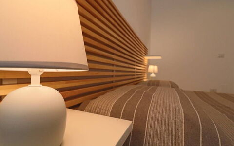 Nausica: Wood, Furniture, Bedroom, Interior Design, Bed, Lighting, Lampshade, Linens, Bed Sheet, Bedding