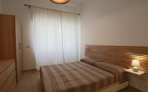 Nausica: Bed, Furniture, Interior Design, Bedroom, Wall, Bedding, Wood, Bed Sheet, Floor, Flooring