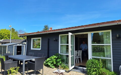 Arise - 1.5Km from the Sea: Door, Home, House, Furniture, Cottage, Siding, Porch, Chair, Yard, Shade