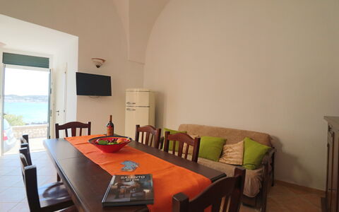 Casa Rachele a Otranto: Furniture, Kitchen & Dining Room Table, Chair, Wood Stain, Hardwood, Dining Room, Varnish, Outdoor Table, Major Appliance, Restaurant