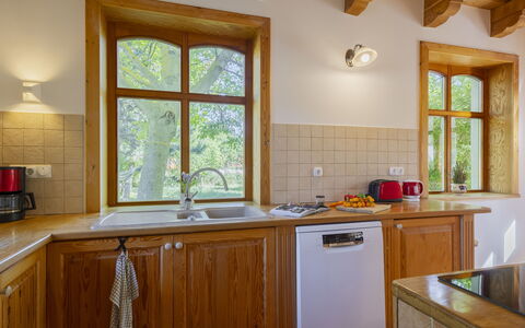 Villa Canela: Wood, Kitchen, Interior Design, Flooring, Countertop, Cabinetry, Floor, Ceiling, Furniture, Plumbing Fixture