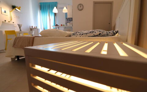 Casa Maya a Otranto: Furniture, Interior Design, Bed, Floor, Flooring, Bedroom, Wood, Room, Lighting, Ceiling