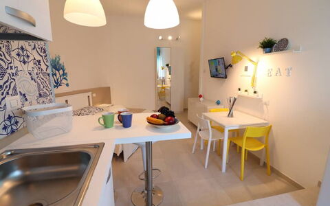 Casa Maya a Otranto: Interior Design, Furniture, Flooring, Wood, Floor, Room, Ceiling, Lighting, Countertop, Kitchen
