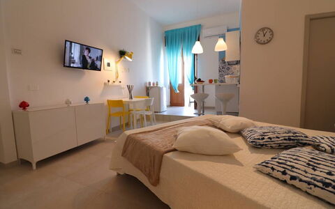 Casa Maya a Otranto: Furniture, Interior Design, Bedroom, Flooring, Floor, Bed, Room, Ceiling, Lighting, Bed Sheet