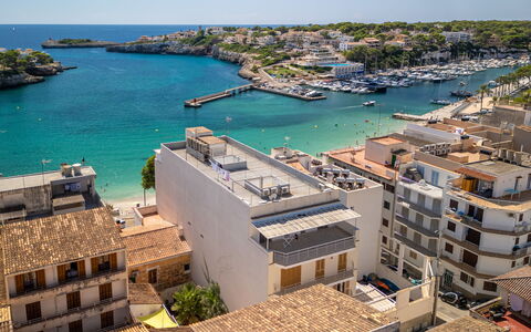 Near the Sea: Apartment, Boat, Watercraft, Residential Area, Sea, Human Settlement, Coast, Tourist Attraction, Balcony, Condominium