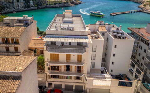 Near the Sea: Building, City, Apartment, Residential Area, Neighbourhood, Town, Human Settlement, Condominium, Mixed-Use, Balcony