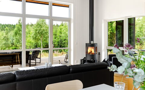 Paradiset 2: Hearth, Flooring, Furniture, Interior Design, Wood-Burning Stove, Floor, Wood Flooring, Living Room, Home Appliance, Fireplace