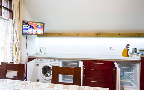 Stodola: Interior Design, Flooring, Major Appliance, Washing Machine, Floor, Ceiling, Furniture, Lighting, Room, Kitchen