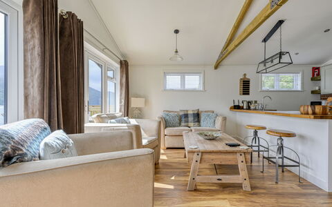 Loch Ness Hamptons Lodge: Wood, Flooring, Floor, Ceiling, Furniture, Wood Flooring, Hardwood, Wood Stain, Couch, Living Room