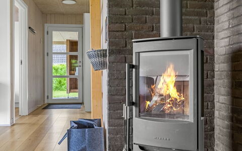 Anabel - 800M from the Sea: Flooring, Hearth, Wood-Burning Stove, Hardwood, Wood Flooring, Chair, Wood Stain, Living Room, Fireplace, Houseplant