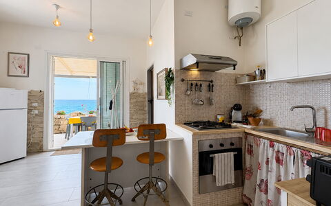 La Casa in Riva al Mare: Furniture, Flooring, Kitchen, Interior Design, Chair, Kitchen & Dining Room Table, Table, Floor, Major Appliance, Apartment
