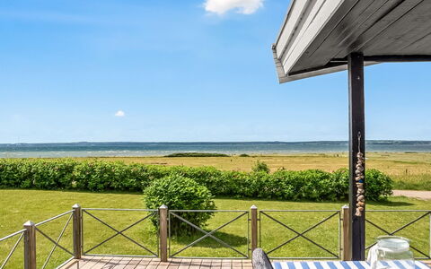Gustav - 50M from the Sea: Sky, Furniture, Shade, Porch, Deck, Outdoor Furniture, Outdoor Table, Coast, Ocean, Chair